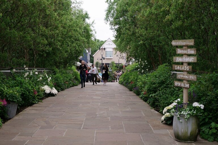 A pedestrian shopping street at Bicester Village, photographed in 2018